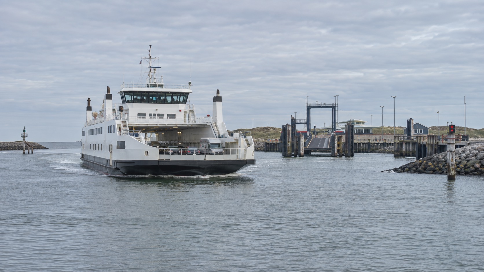 Car and passenger ferry approaching the harbour at Den Helder on the way to Texel